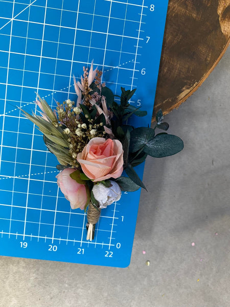 Pink and peach flower boutonniere