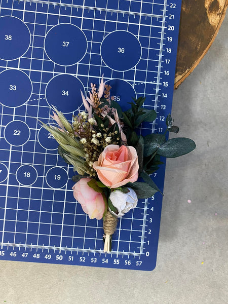 Pink and peach flower boutonniere