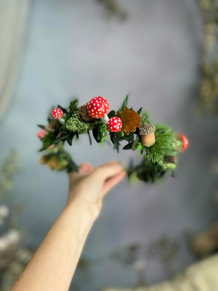 Woodland flower half wreath with red mushrooms