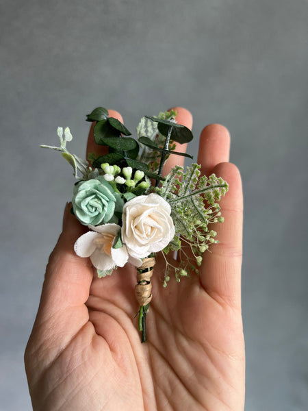 Sage green and white boutonniere