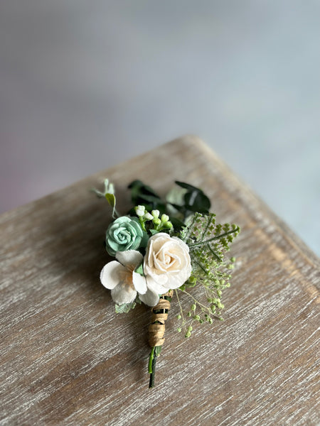 Sage green and white boutonniere