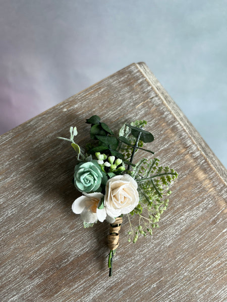 Sage green and white boutonniere