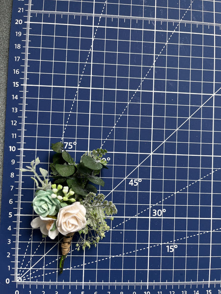 Sage green and white boutonniere