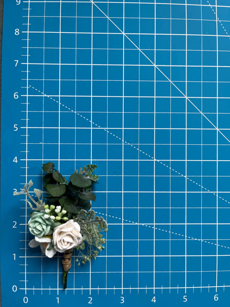 Sage green and white boutonniere