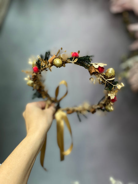 Golden Christmas flower wreath with cinnamon