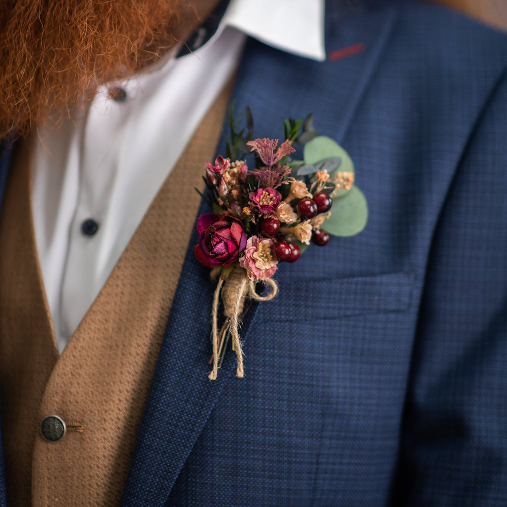 Burgundy flower boutonniere with berries