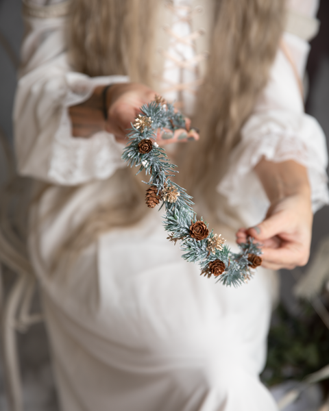 Winter flower half wreath with pine cones