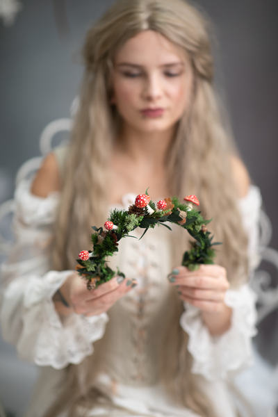 Woodland flower half wreath with red mushrooms