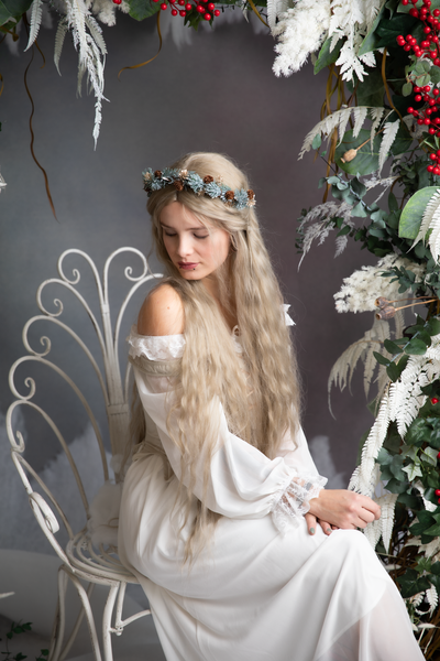 Winter flower half wreath with pine cones