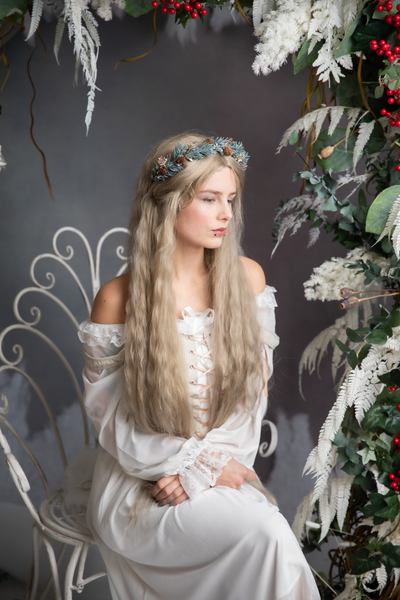 Winter flower half wreath with pine cones