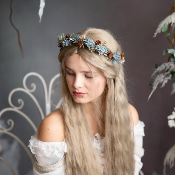 Winter flower half wreath with pine cones