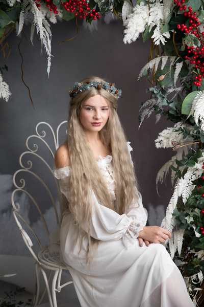 Winter flower half wreath with pine cones