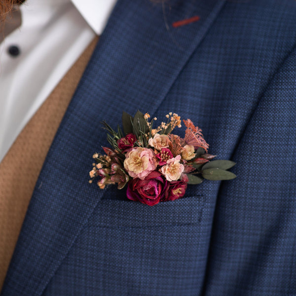 Burgundy groom's pocket boutonniere