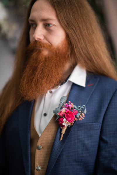 Pink and magenta flower boutonniere