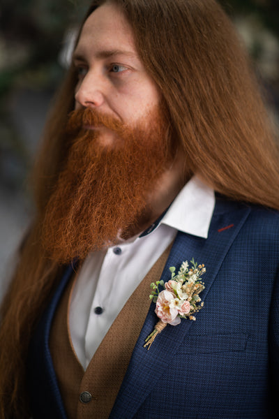 Blush flower boutonniere for groom