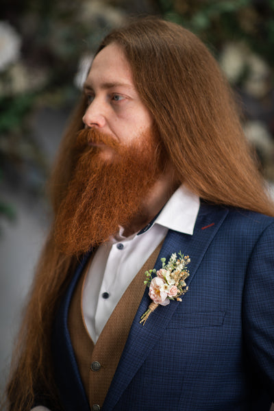 Blush flower boutonniere for groom