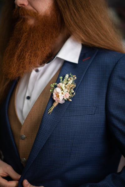 Blush flower boutonniere for groom