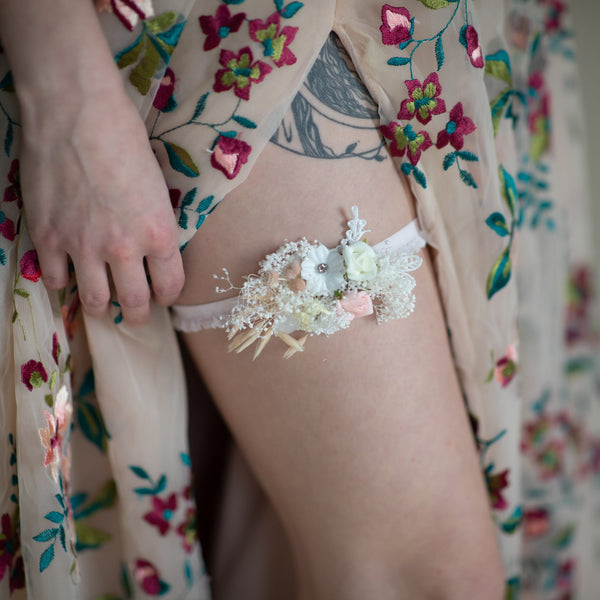 Romantic blush and white bridal garter